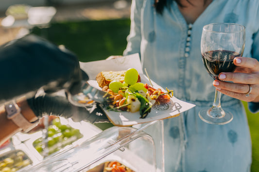 Wandering Graze Co catering a party with their mobile Tucson charcuterie cart